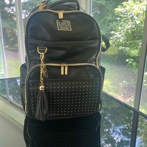 Itzy Ritzy Chelsea and Cole, vegan leather boss bag.